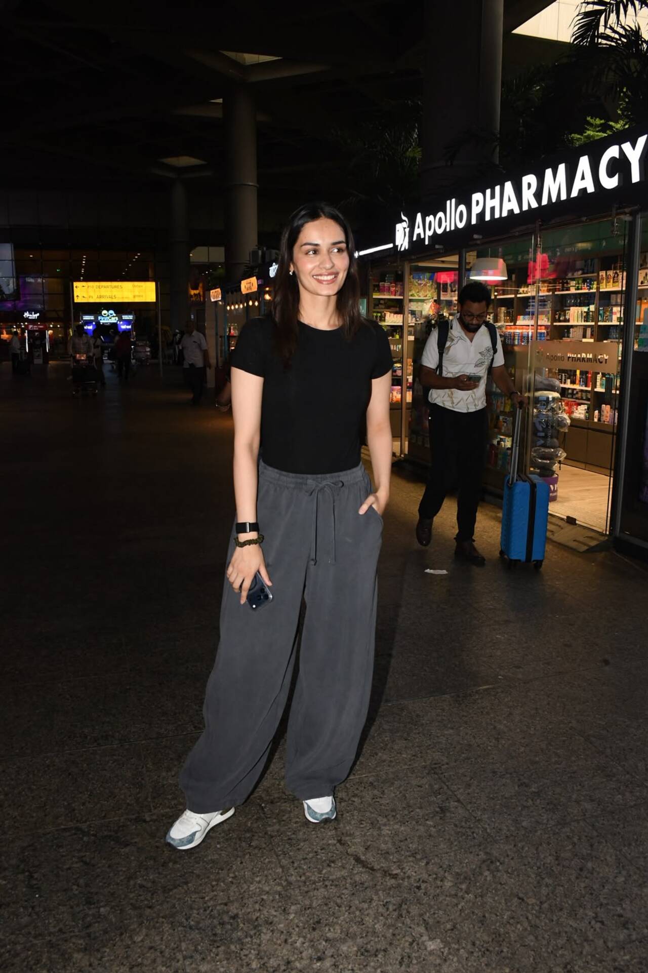 Manushi Chhillar was snapped at the airport in a fuss-free yet elegant look. The actress opted for a classic black T-shirt paired with loose grey trousers and comfortable sneakers. Manushi Chhillar was snapped at the airport in a fuss-free yet elegant look. The actress opted for a classic black T-shirt paired with loose grey trousers and comfortable sneakers.